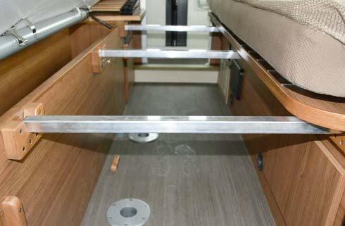 the face of the driver side twin bed cabinet) to align