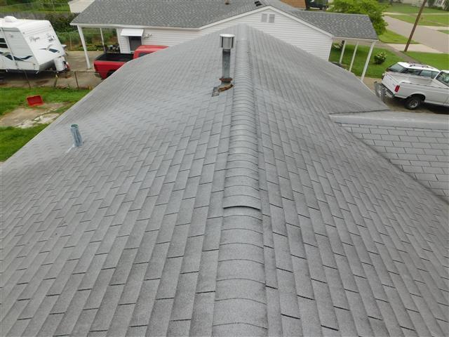 I would guess the roof is about 10 yrs old (give or take a year or two).