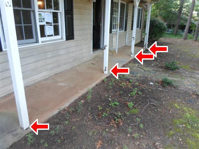 3 The covered porch posts were not secured properly to the ground.