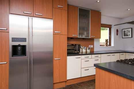 ice feature, large island unit with stainless steel oven, four ring hob and extractor fan, high breakfast bar, built in wine rack, plumbed for dishwasher, space for 4/6 seater dining table and