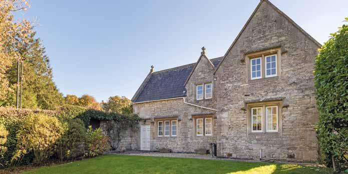 OUTSIDE A detached cottage sits at the top of a long gravel driveway which leads along an immaculate formal garden with a large parking area. There is an excellent range of outbuildings and garaging.