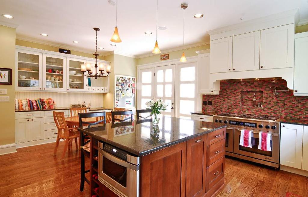 In the kitchen, DiSalvo redid the floor and renovated the kitchen with new cabinetry and a glass tile backsplash.