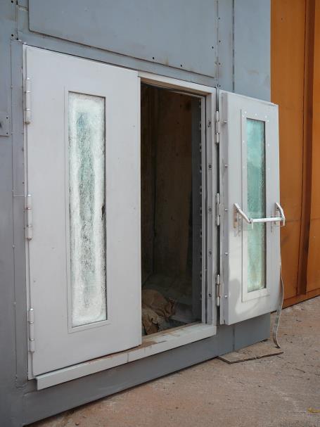 Explosive test according to customer requirements with 200 kg explosive (photo 1) Test of a double glazed steel door, multi bolt self locking system with emergency exit operation.