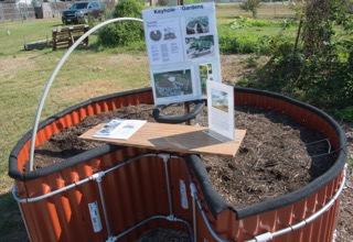 A keyhole garden kit on display can be