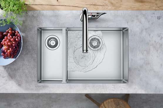 hansgrohekitchensink_s719_u655_ambience01 Elegantly recessed into a natural stone countertop: the hansgrohe undermount sink S711-F655.