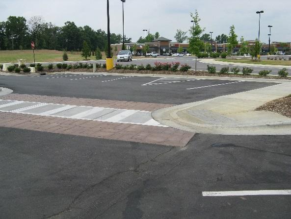 pedestrian crossing treatments along functional pedestrian routes wherever a private walkway
