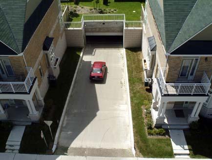 58: Landscaped Rear Laneway Accommodating parking in shared underground garages or at the rear of a building results in pedestrian-friendly streetscapes, whereby front entrances, windows and