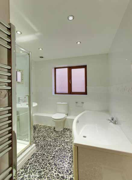 Cloakroom/WC With half tiled walls, fully tiled floor, central heating radiator