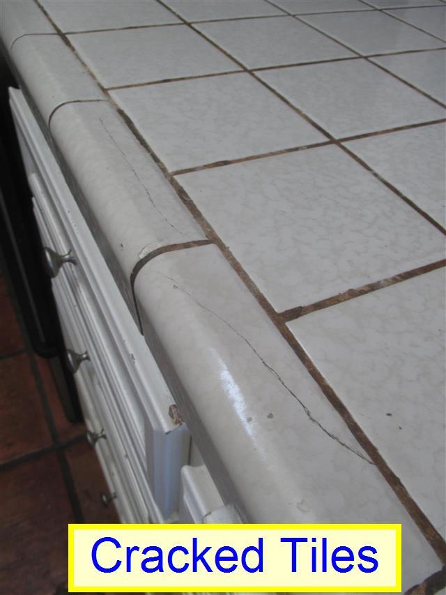 Dryer Power Source: 120V/240V / GAS CONNECTION Items 4.0 COUNTERS AND SINK Cracked Tiles Noted. There are cracked tiles at the counter.