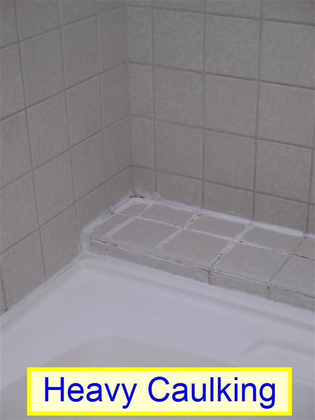 (2) Heavy Caulking at Tub. The sides of the tub were heavily caulked. This may indicate that there was a problem at this location.