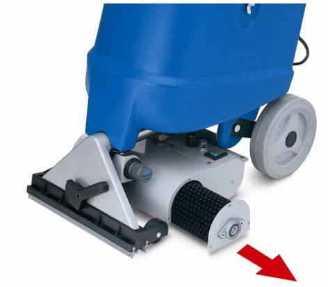 The operator moves the machine on the carpet surface, cleaning parallel floor areas, which