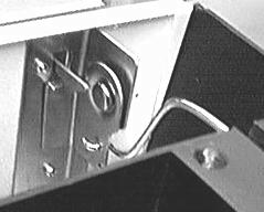 The bracket clip is in serted into the rear oven panel, and is held by the latch