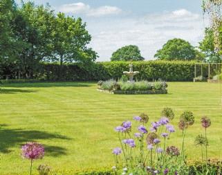The formal south facing gardens are quite magnificent and make the most of the undulating country views.