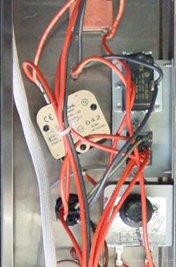 If there is no voltage, open oven door and manually depress door microswitch actuator at bottom right of oven.
