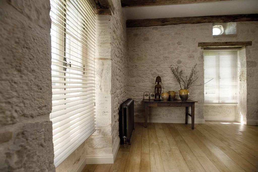 The special wooden blinds are easy to mount and don t have panels that hinge into the room.