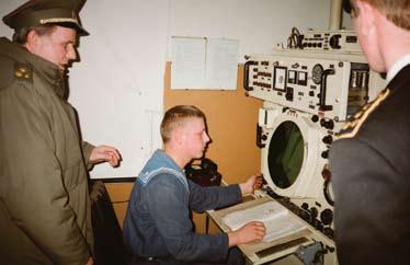 Olegas Mariničius pagal IMET programą mokėsi ir užbaigė Jūrų pajėgų štabo koledžą JAV. 1996-02-02 įkurta Ryšių ir stebėjimo tarnyba, kuri 1997 m. sausio 30 d.