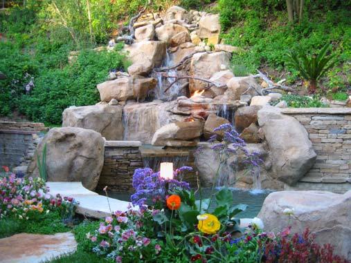 A BIRD S EYE VIEW (STAN) Features: Hillside Pool and natural spa Dramatic Stone Waterfall Beautiful hillside steps-stairway leading to patios and specialty gardens Outdoor Room with fireplace with TV