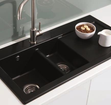 Inset ceramic sinks with their elegant lip and smooth lines, blend subtly into the worktop surface.