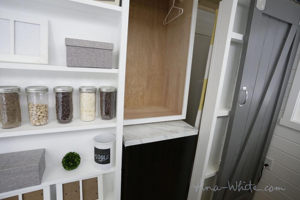 The cabinet fits perfectly under the sliding closet allowing laundry to be put away easily.