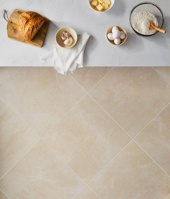 with a high-end marble look. The cream-colored tones warm up the walls and floors of any space where this collection is used.