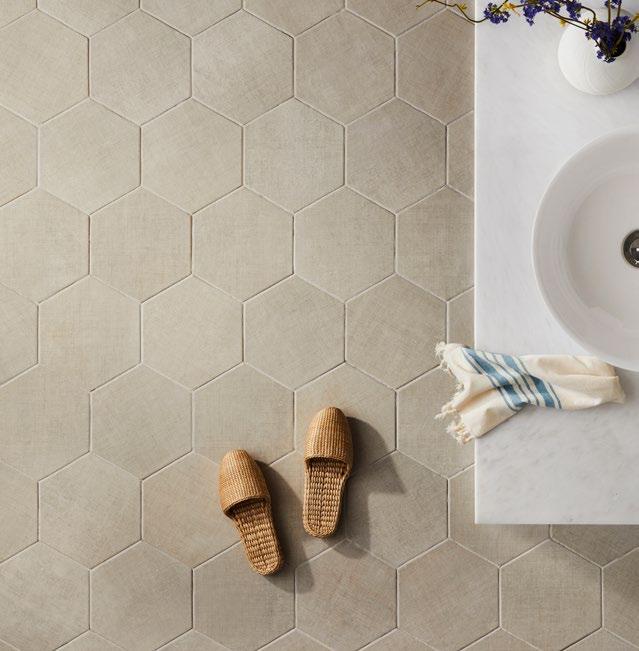 hexagonal tile brings more than meets the eye with a patterned surface that mimics the texture of linen.