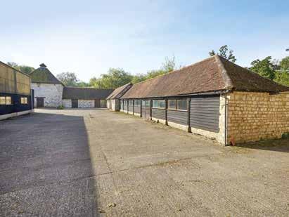 Former stone threshing barn with concrete floor, pitch roof, light and power connected. Various offices. Stone dovecote. Stabling.