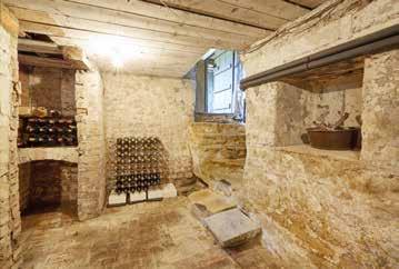 The cellar is ideal for wine storage having arched wine bins, brick floor,