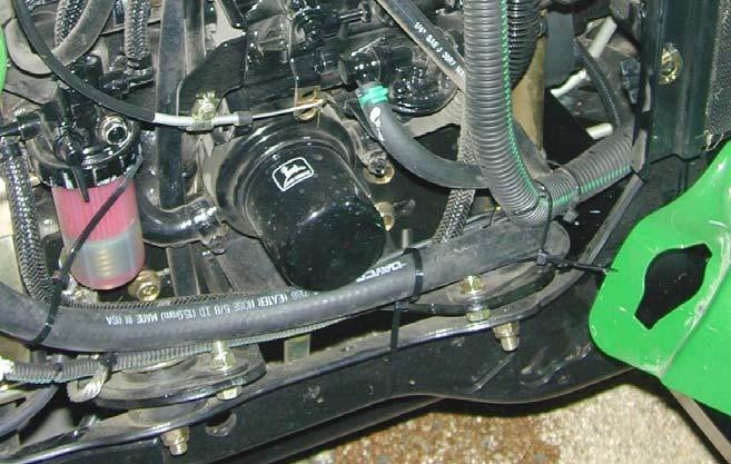 Locate heater to fuse block wire harness (17). From inside of cab, route wire harness from heater, up LH cab frame tube to overhead switch panel fuse block location (Figure 6). 27.