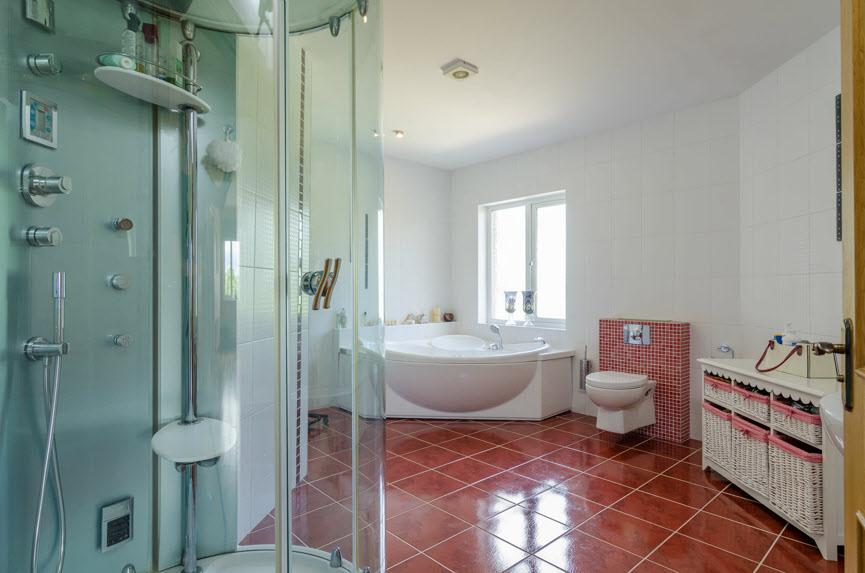 BATHROOM: White suite comprising corner Jacuzzi bath with multi jets and shower attachment, wc, 1/2 pedestal wash hand basin shower cubicle with multi jets (double s as a sauna), fully