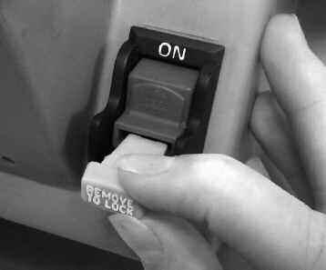 To disable the on/off switch, remove the insert from the end of the switch by grasping and pulling on the insert (Fig. 11). Store the insert in a secure location, out of reach of children.