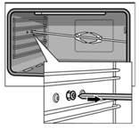 Open the appliance door, then carefully remove the rotary spit from the holder. 2.
