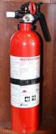 SECTION 2 - SAFETY AND PRECAUTIONS FIRE EXTINGUISHER A dry chemical Fire Extinguisher is located near the main entrance door.
