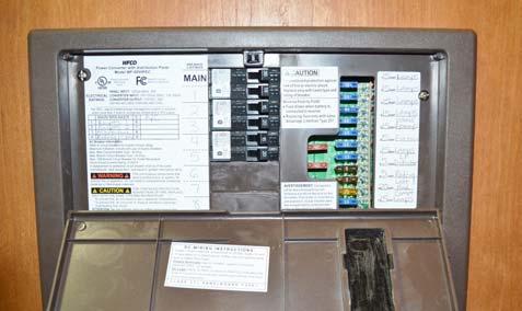 SECTION 6 - ELECTRICAL Fluid level check may be omitted if equipped with maintenance-free batteries. The fuse panel is located on the right-hand side of the Power Converter.