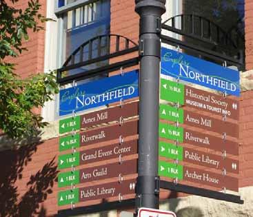 Specific Design Guidelines - Appropriate downtown Sign Types wayfinding signs RECOMMENDED Comprehensive wayfinding sign system including community identity design feature as part of bracket.
