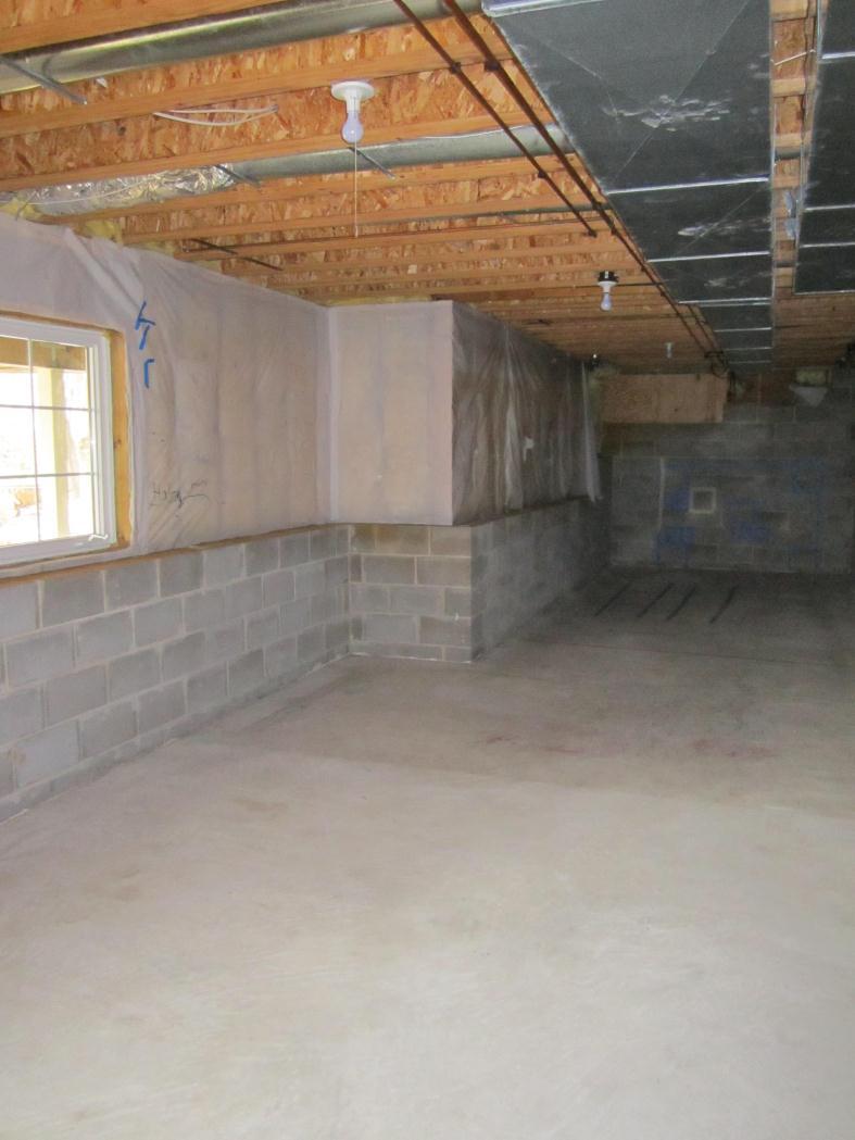 BEFORE PHOTO: #1 Low hanging ductwork and plumbing locations in this unfinished basement