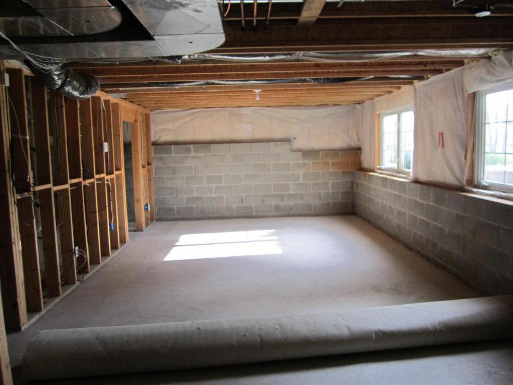 BEFORE PHOTO: #2 This unfinished basement was long and narrow, creating a