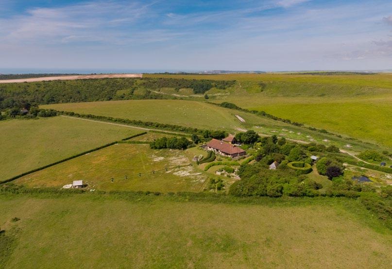 Meadowdown Alfriston, East Sussex, BN26 5XW A substantial property standing in a unique and spectacular elevated position on the South Downs, with magnificent unspoilt far reaching views.
