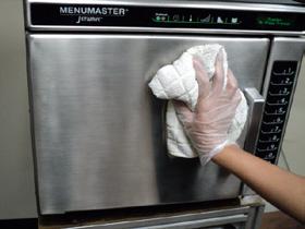 Clean and Wipe Oven Interior Clean the oven using a composite scouring pad. Wipe the oven interior using a damp clean towel, rinse towel and wring dry.