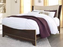 Contemporary style meets traditional elegance in this bedroom group Replicated mahogany grain in a deep dark red finish Headboard upholstered in a soft gold color with faux crystal buttons Case