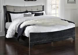 Contemporary style meets traditional elegance in this bedroom group Black glossy finish highlighted with pearl over replicated spiral ash grain Headboard upholstered in a bright silver color with