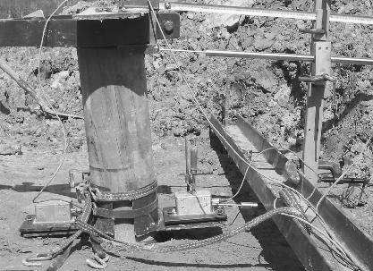 Figure 2: Pole under lateral load showing the instrumentation attached. becomes more silty. The testing was done in the spring so there was not too much of a problem from drying out of the clay.