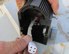 Gently slide the electrical enclosure from the aluminum body, while