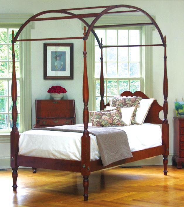 Sheraton Field Bed WITH SMOOTH POSTS IN TIGER MAPLE OR CHERRY circa 1780-1820 THE DESIGN OF TURNED BEDS is largely attributed to Thomas Sheraton and George Hepplewhite, two English craftsmen who
