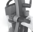 Stand the vacuum upright and slide the base of the handle firmly into the opening at the top of the vacuum body. 3.