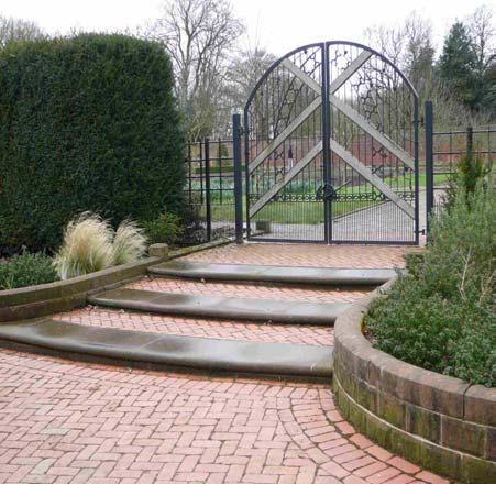 PLEASURE GROUNDS: FOOTPATHS, MATERIALS PG3 - Brick (clay) pavers, with associated red sandstone steps into Kitchen Garden, and low red sandstone walls supporting raised bed in northern half.