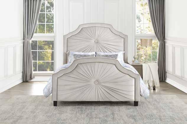 The profile of the bed features nail head accent lending definition to the contoured shape of the collection.