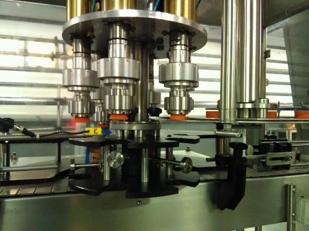 Solutions Capping Machines: Full automation of cap unscrambling. Change parts to run multiple types of bottles and caps on the same machine.