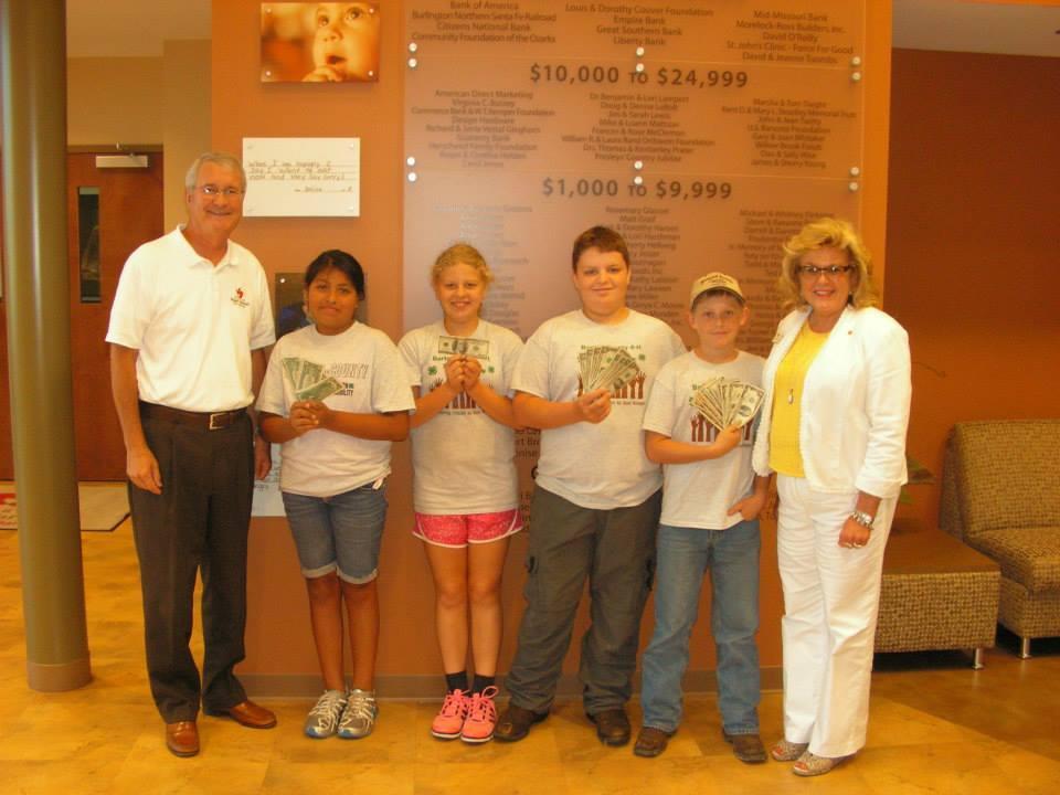 Food Bank Donation 4-H youth visited the Ozark Harvest Food Bank (Feeding America) in Springfield, MO to deliver a donation of $300.