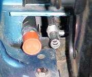 Insert studs on rear mounting bracket through original heater
