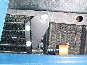 Attach lower (2) condenser mounting brackets Through front of